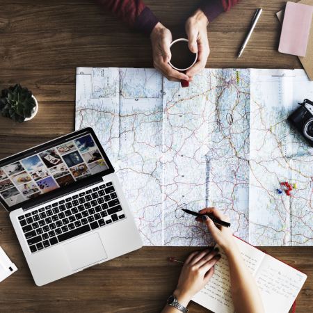 Travellers comparing holiday options online and feeling overwhelmed